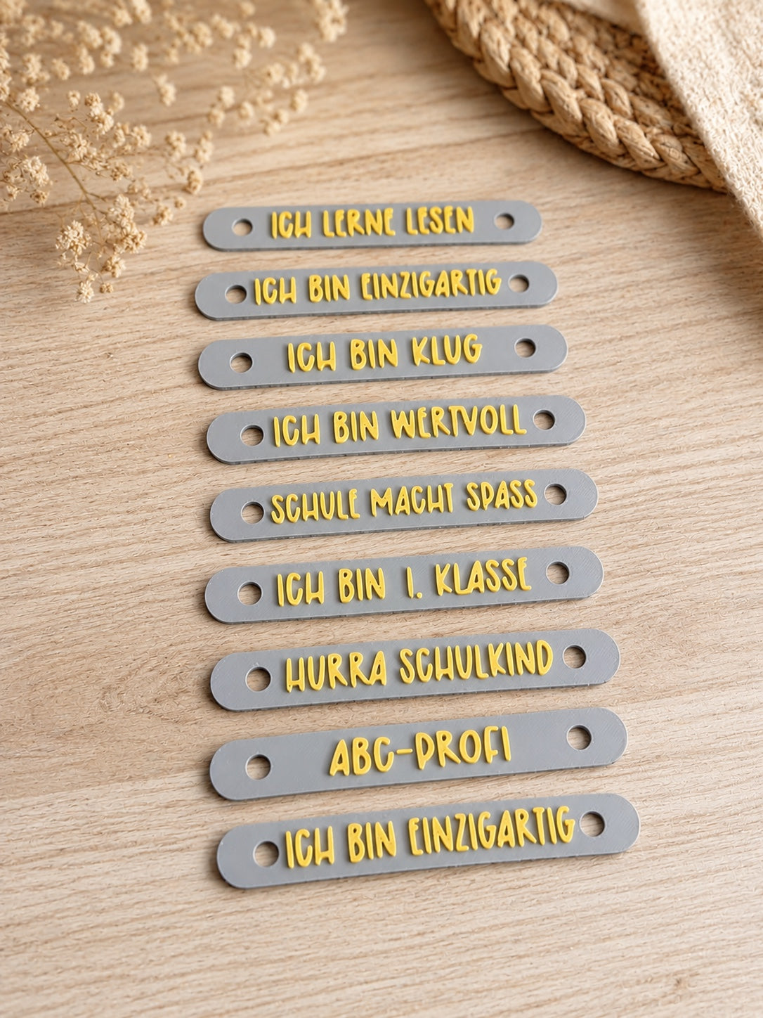 3D-gedruckte Heftstreifen mit Schul- und Mutmach-Sprüchen im 9er-Set